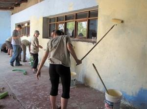 Volunteers Painting on a Service Project Overseas Volunteers painting a school building on a service trip abroad