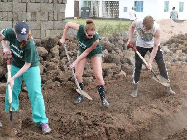 Volunteers Dig on Building Project with Projects Abroad Projects Abroad volunteers work at the building site of the new Projects Abroad Academy for Maasai children