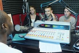 Journalism Volunteers on the International Journalism Internship in Jamaica learn from a local DJ.