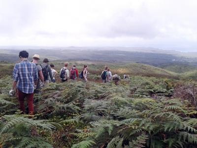 A group of volunteers hike in the mountains in Ecuador Projects Abroad volunteers take a walk on the Galapagos Islands