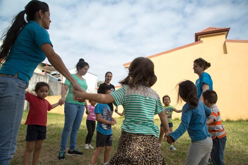 A group of Projects Abroad volunteers play a game during recess for their kindergarten class in Costa Rica A group of Projects Abroad volunteers play a game during recess for their kindergarten class in Costa Rica
