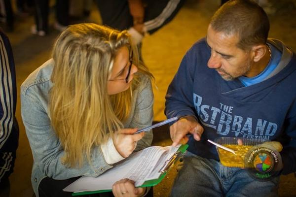 A Projects Abroad Human Rights intern assists homeless man in Argentina Projects Abroad Human Rights intern interviews a homeless man in order to try and help him get a pension and ID card in Cordoba, Argentina.