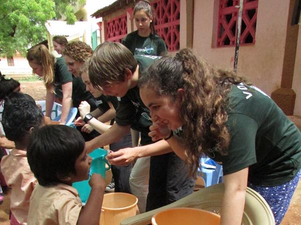 Volunteers Doing Dental Outreach in India Projects Abroad medical volunteers teach children about basic healthcare on a hygiene outreach in India.