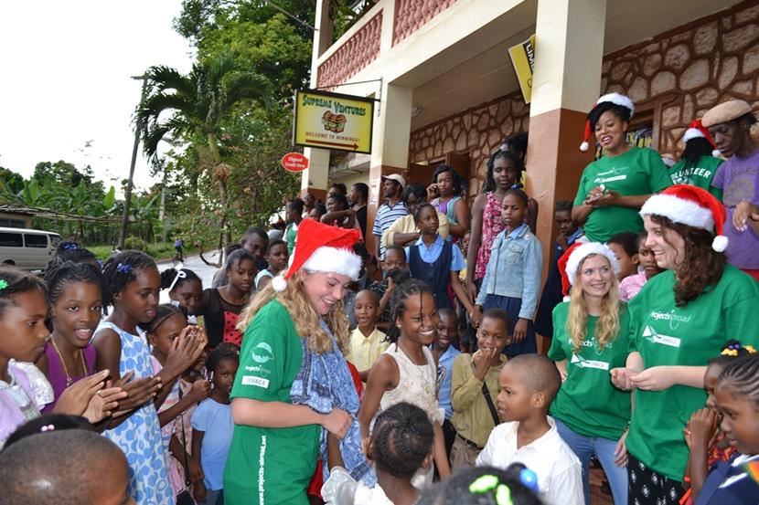 Projects Abroad volunteers play with children after distributing gifts in Jamaica for Operation Krismus Smile. Projects Abroad volunteers play with children after distributing gifts in Jamaica for Operation Krismus Smile.