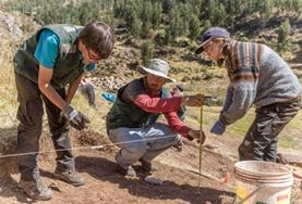 Archaeology A group of volunteers examine an excavation site at the Archaeology Project in Peru.