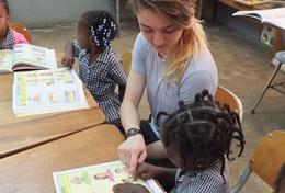Care A volunteer with a young child at a care center in Jamaica.