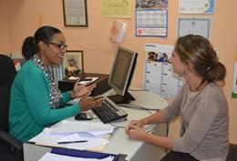 Care A volunteer discusses a case with a Children's Rights officer in Jamaica.