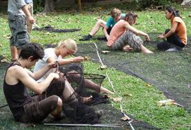 Conservation & Environment Volunteers on the Rainforest Conservation Project in Peru sew nets as part of their project work.
