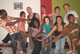 Creative & Performing Arts Volunteers and students practise dance moves to accompany Jamaican music.
