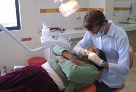 Electives for Medical<br /> Students A Bolivan dentist performs a dental examination on a patient.