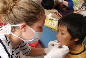 Electives for Medical<br /> Students A child's gums are examined by a volunteer on the Peru Dentistry School Elective.