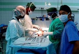 Electives for Medical<br /> Students Volunteers on the Medical School Elective in Ghana observe a surgery as doctors operate on a patient.