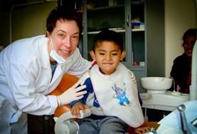 Electives for Medical<br /> Students A Nursing School Elective student with a young patient at her placement in Bolivia.