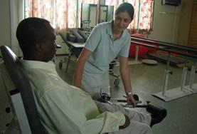 Electives for Medical<br /> Students A Physical Therapy Student on her Elective in Ghana assists a man with his therapy.