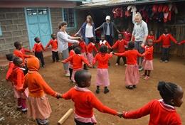 Kenya Young children play a game with Care & Community High School Special volunteers in Kenya.
