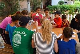 Morocco High School Special volunteers in Morocco work on an arts and crafts project with young children.