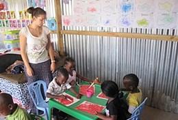 South Africa A volunteer watches a group of children on the Care & Community High School Special in South Africa.