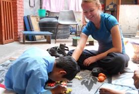 Nepal A student on the Physical Therapy High School Special in Nepal works with a young boy at her placement.
