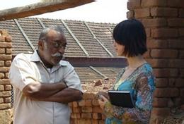 Volunteer on the Journalism Project Collects Writing Material Intern on the Journalism project interviews locals for material