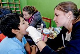 Peru In Peru, a medical intern assists with a medical outreach.