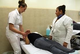 Mexico A student on the Physical Therapy Internship in Mexico learns new stretches from her supervisor.