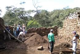 Archaeology Professional archaeologists work with staff at a local digging site in Peru.