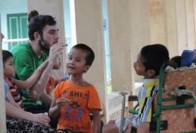 Vietnam A speech therapist volunteering with children at a rehabilitation center in Vietnam.