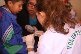Medicine & Healthcare Volunteer nurses work to help patients in a hospital, based in Peru.