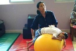 Cambodia A therapist uses techniques taught by a physical therapist volunteering in Cambodia.
