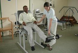 Medicine & Healthcare A physical therapist treats a patient at a hospital in Ghana.