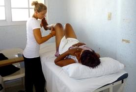 Medicine & Healthcare A physical therapist volunteering in Jamaica, with one of her patients.