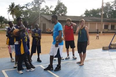 Sports A volunteer coaches basketball to teenagers at a club in Ghana.