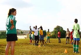 Sports Children practice soccer skills with a volunteer during a physical education class in Jamaica.