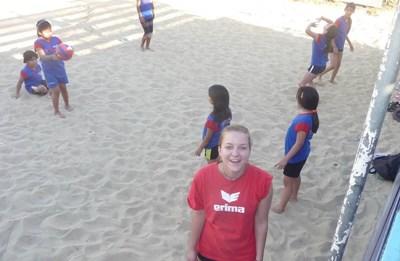 Sports A volunteer coaches a volleyball lesson for young students in Bolivia.