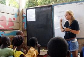 Teaching A volunteer teaches a French class at a school in Ghana.